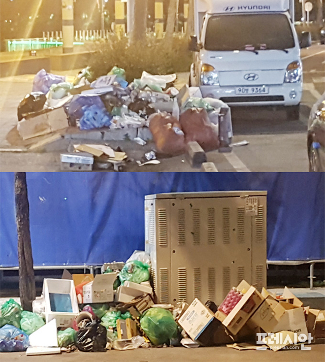 ▲여수시의 대표 관광지인 해양공원 도로변에 수거해 가지 않은 쓰레기 더미가 수일째 쌓여있다. ⓒ 프레시안(진규하)
